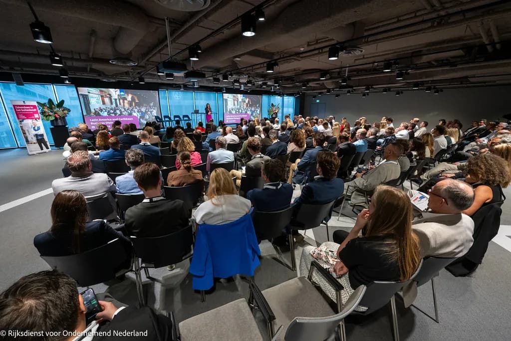 Participants seated at a business conference